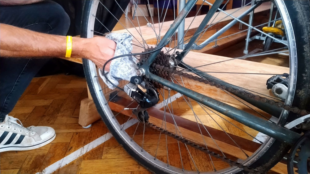 Oiling a bike at the Repair Café in Crowborough